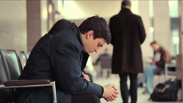 Person experiencing anxiety in a public social environment