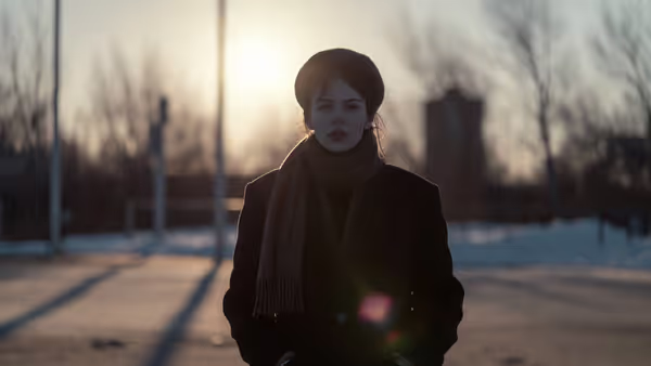 Adult outdoors in winter with low sunlight exposure
